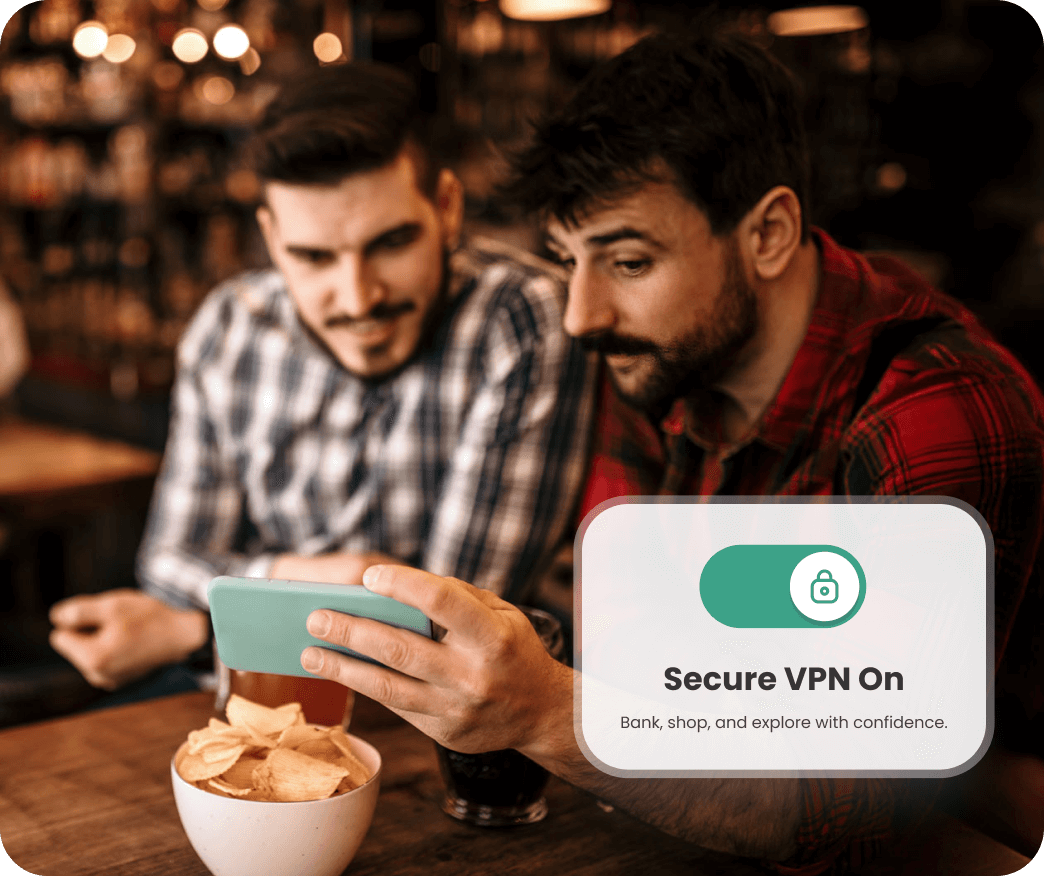 Two people sitting at a table looking at a smartphone with a Secure VPN On notification displayed.