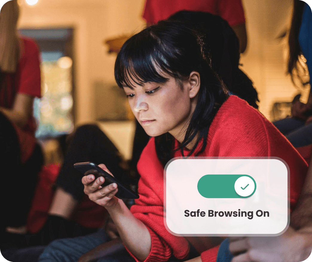 Person holding a smartphone with a Safe Browsing On notification displayed.