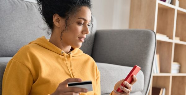 Woman online shopping with a credit card