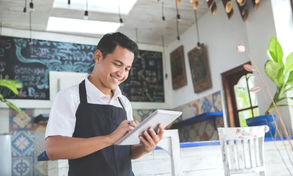 restaurant worker using a tablet