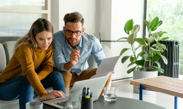 couple doing financial planning using laptop