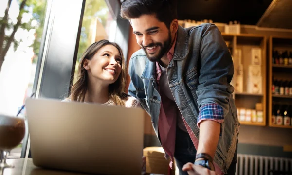 couple online working at a coffee shop