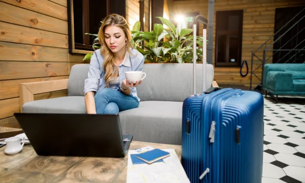 woman booking flights online on her laptop