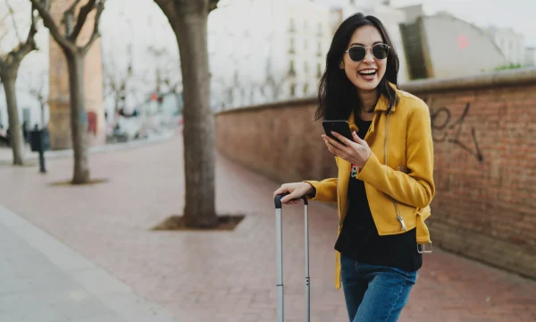 traveling woman checking her phone