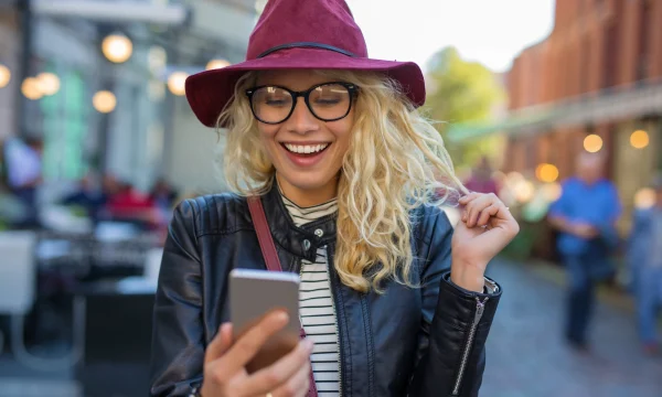 shopaholic woman checking her mobile purchases