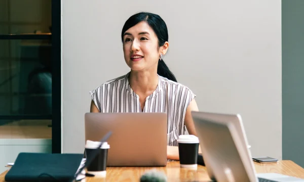 woman with laptop in a meeting table